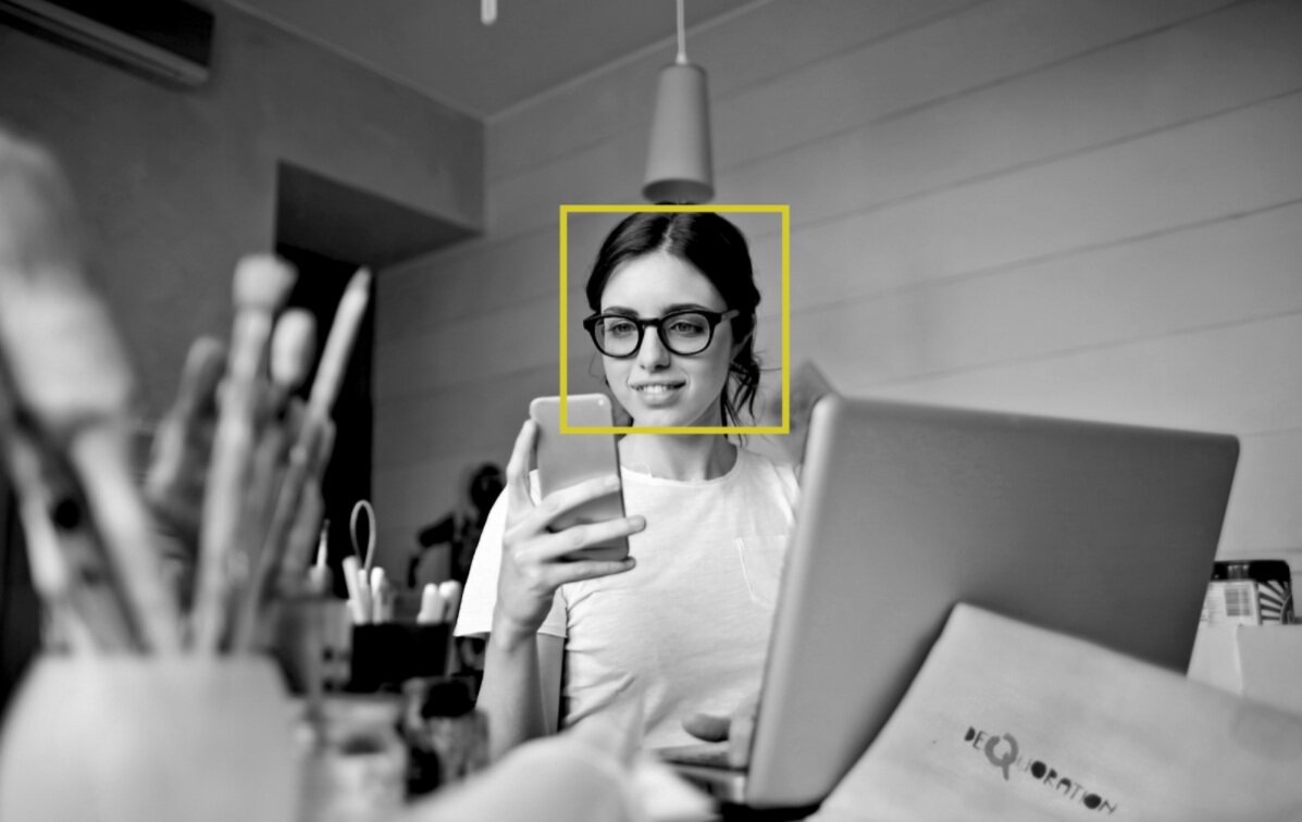 girl using a mobile facial recognition software