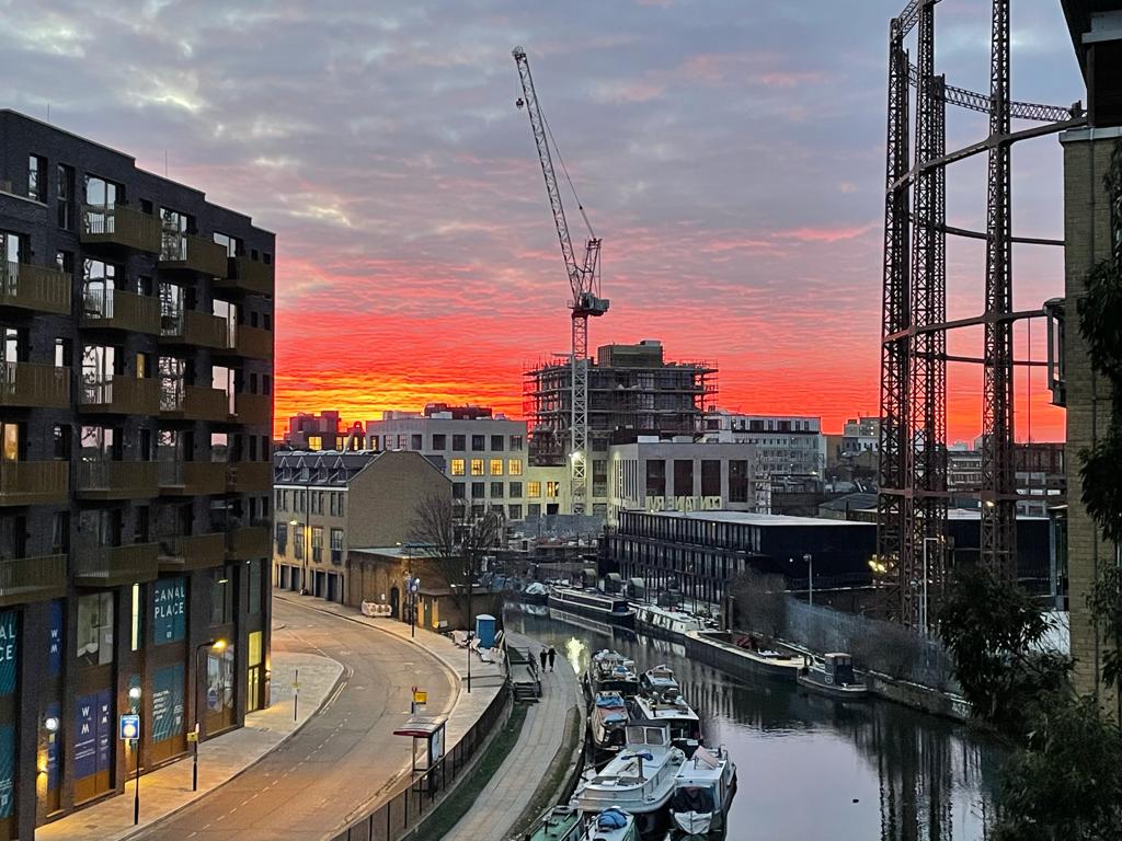 sunset over construction site in hackney london