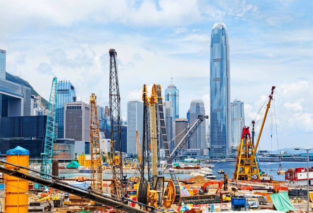 construction site in front of metropolis skyline